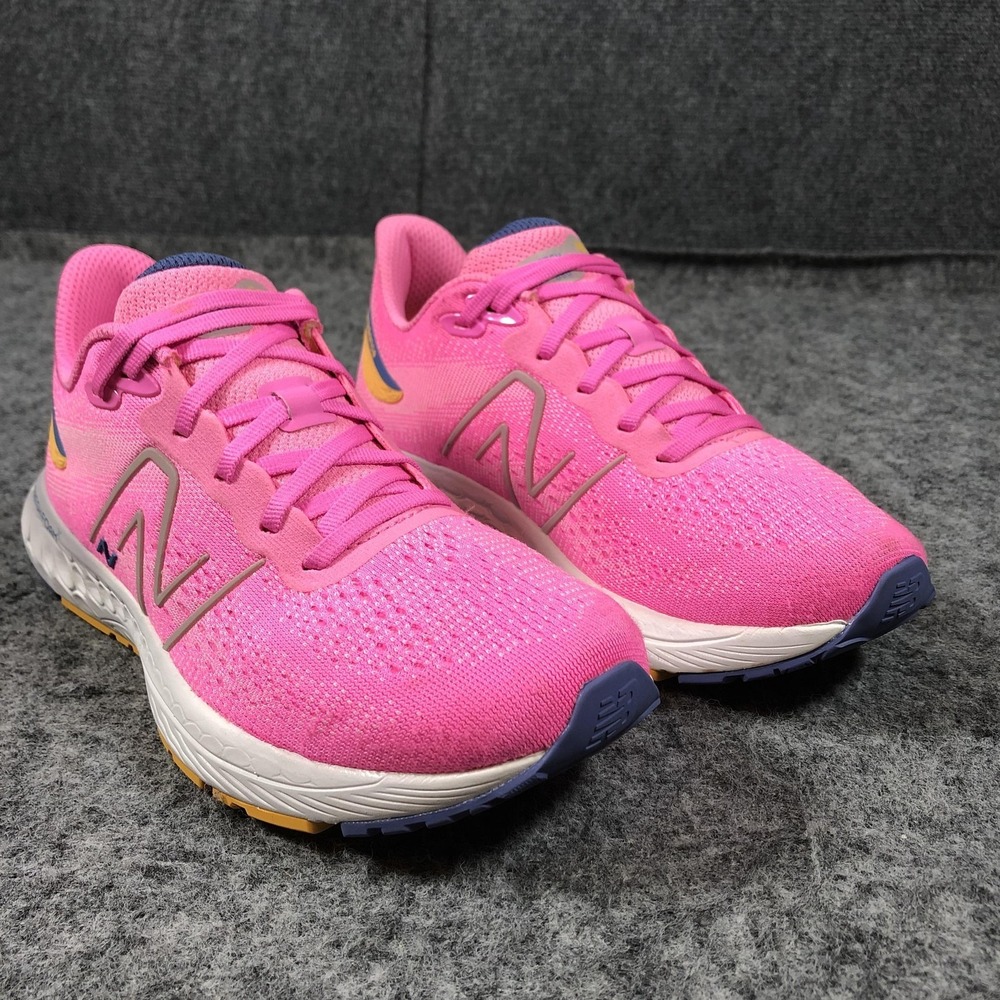 New Balance Pink Athletic Shoes with Blue and Yellow Accents